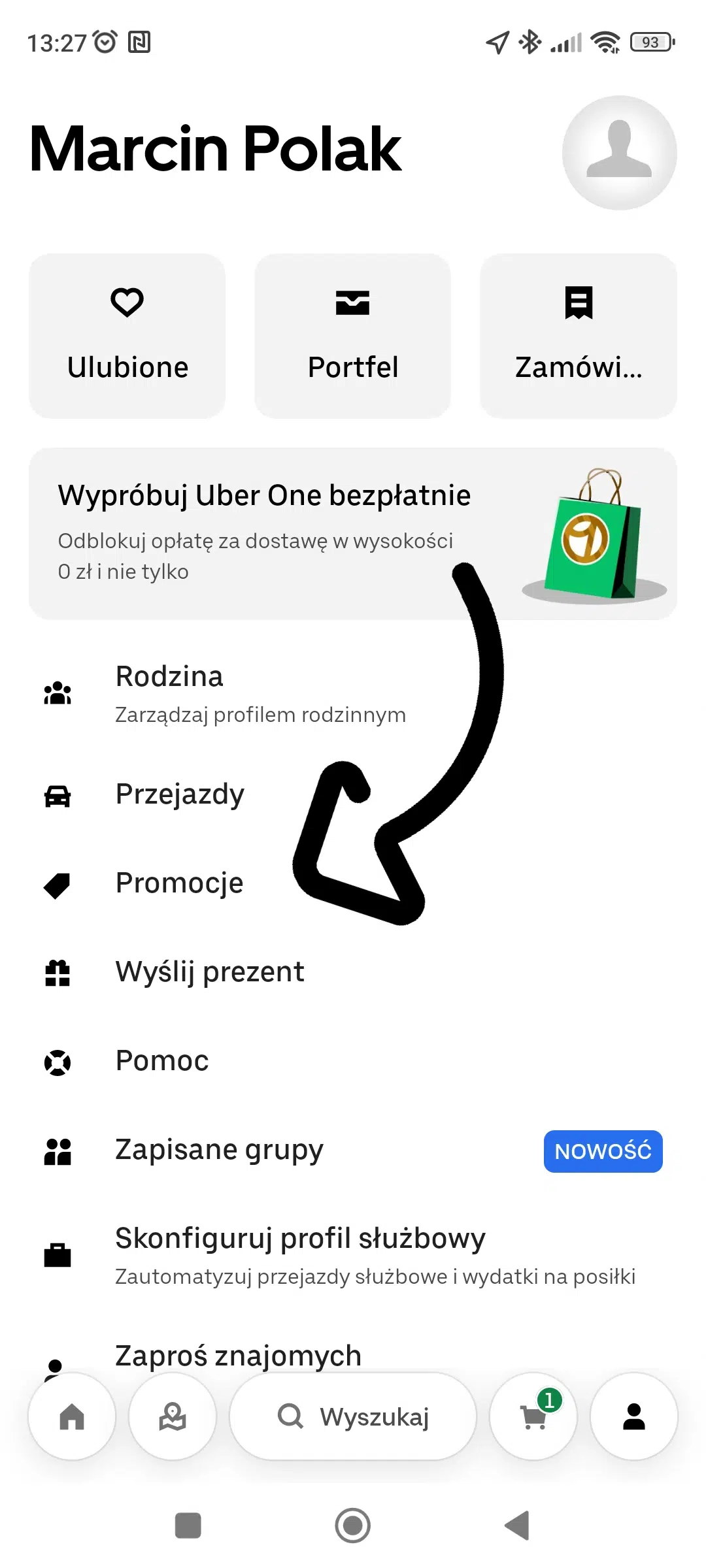 Profil użytkownika Marcin Polak w aplikacji Uber z widocznym menu: Ulubione, Portfel, Zamówienia oraz sekcją Promocje zaznaczoną strzałką.
