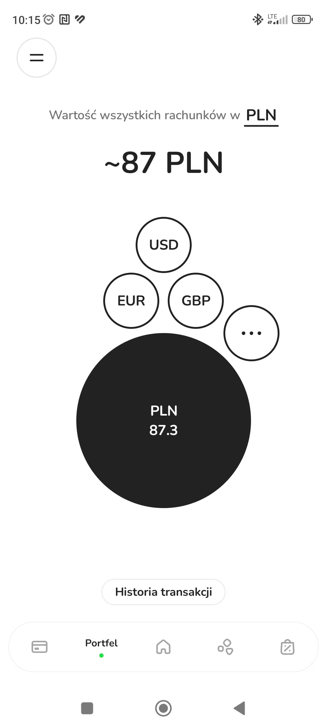 Widok portfela walutowego w aplikacji ZEN.COM z saldem około 87 PLN, kontami w walutach PLN, USD, EUR i GBP oraz przyciskiem Historia transakcji.