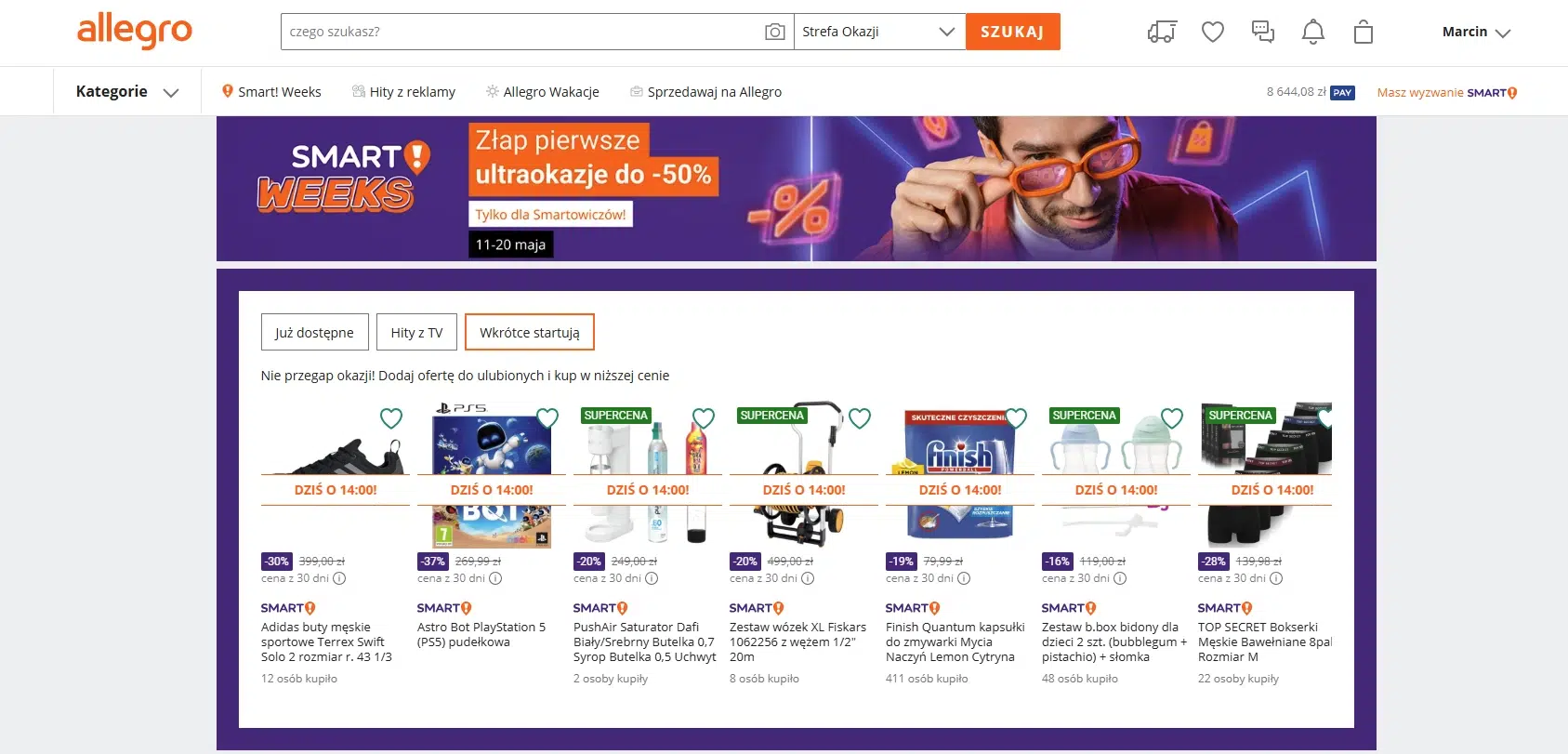 Strona Allegro Smart! Weeks 2026 z banerem promocji do -50% oraz sekcją „Wkrótce startują”, prezentującą nadchodzące oferty i produkty dostępne w niższych cenach dla użytkowników Allegro Smart!.