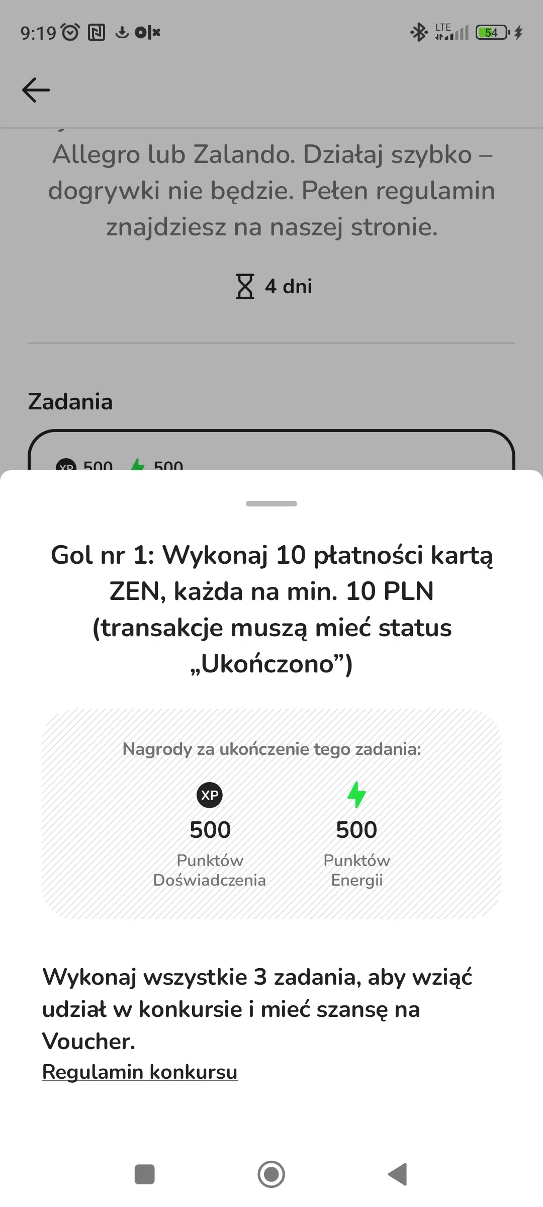 Zrzut ekranu z aplikacji ZEN.COM pokazujący pierwsze zadanie w konkursie „Strzel hat-tricka z Messim”. Użytkownik musi wykonać 10 płatności kartą ZEN na minimum 10 PLN każda, a transakcje muszą mieć status „Ukończono”. Na ekranie widoczne są również nagrody za wykonanie zadania: 500 punktów doświadczenia i 500 punktów energii.
