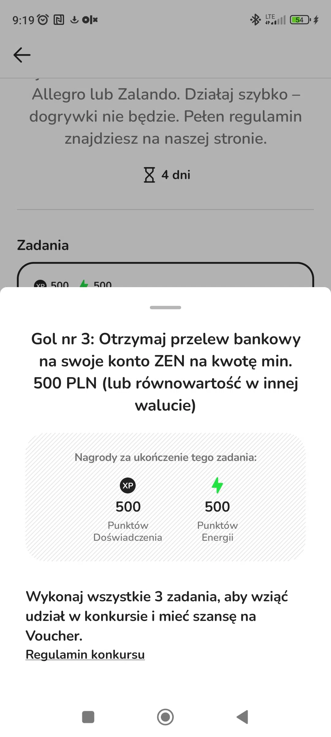 Zrzut ekranu z aplikacji ZEN.COM przedstawiający trzecie zadanie w konkursie „Strzel hat-tricka z Messim”. Zadanie polega na otrzymaniu przelewu bankowego na konto ZEN na minimum 500 PLN lub równowartość tej kwoty w innej walucie. Na ekranie widoczne są również nagrody za ukończenie zadania — 500 punktów doświadczenia oraz 500 punktów energii — a także informacja o konieczności wykonania wszystkich 3 zadań, aby zdobyć szansę na voucher do Allegro lub Zalando.